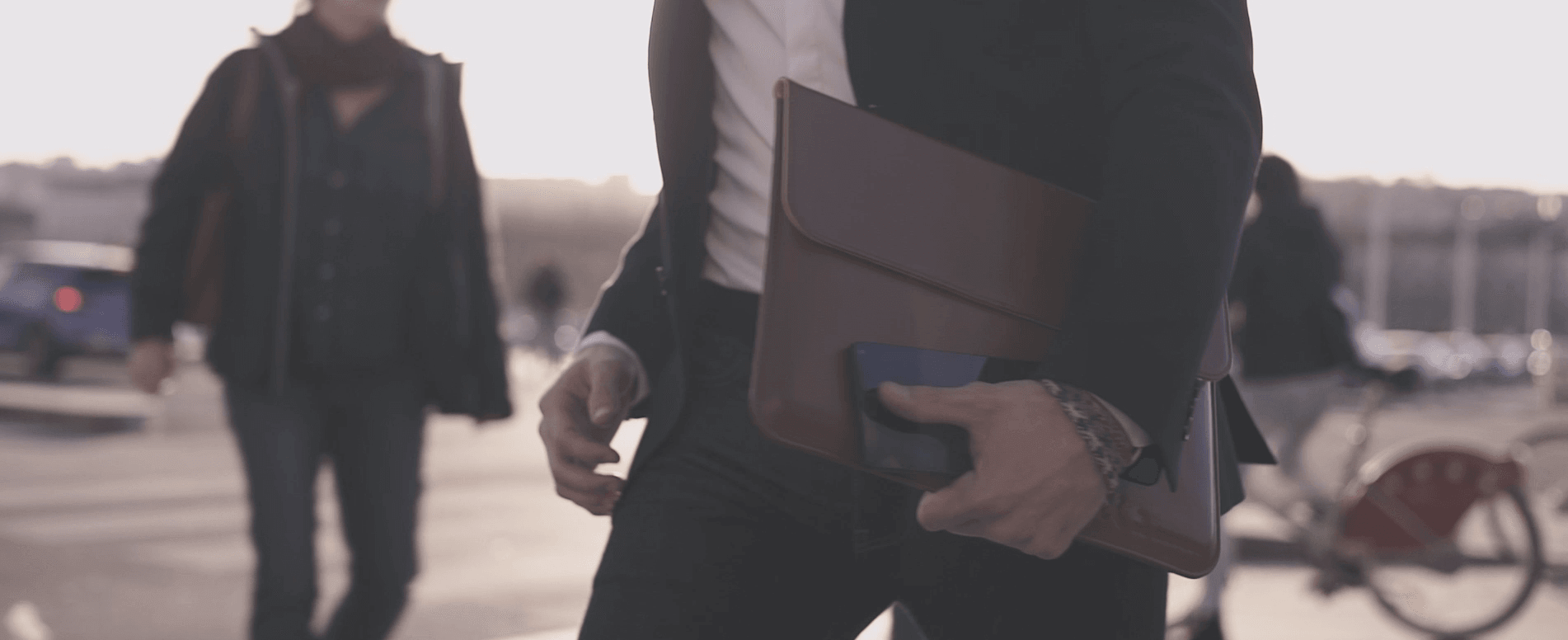 Miraxess laptop sleeve hold by man in suit